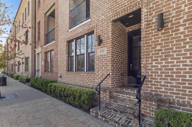 a view of a brick buildings with many windows