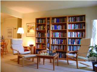 134 Turtle Creek Road, Unit 6 Charlottesville, VA 22901 - Photo 1 of 5 a view of a livingroom with furniture and bookshelf