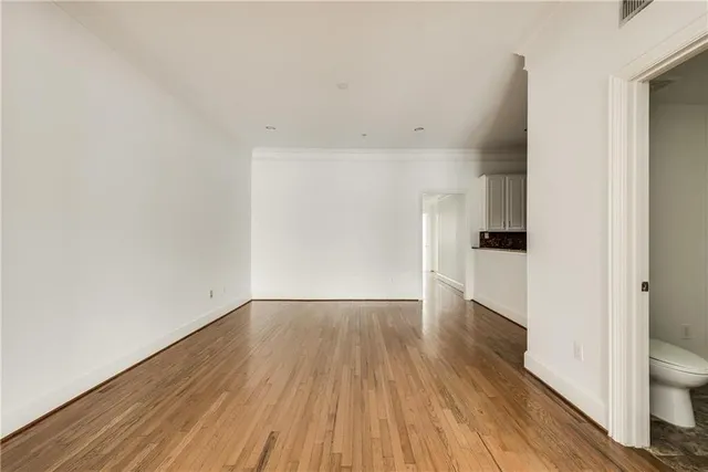 a view of wooden floor and a sink in a room