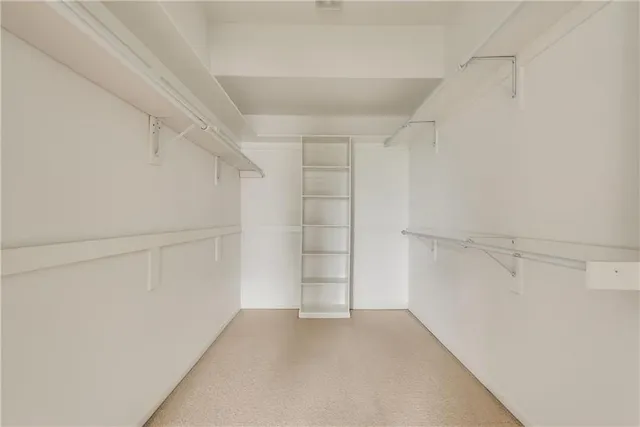 a view of an empty walk in closet