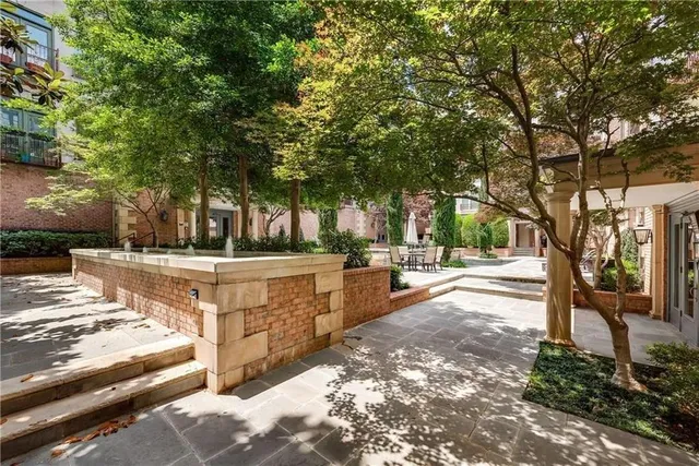 a view of a yard with wooden fence