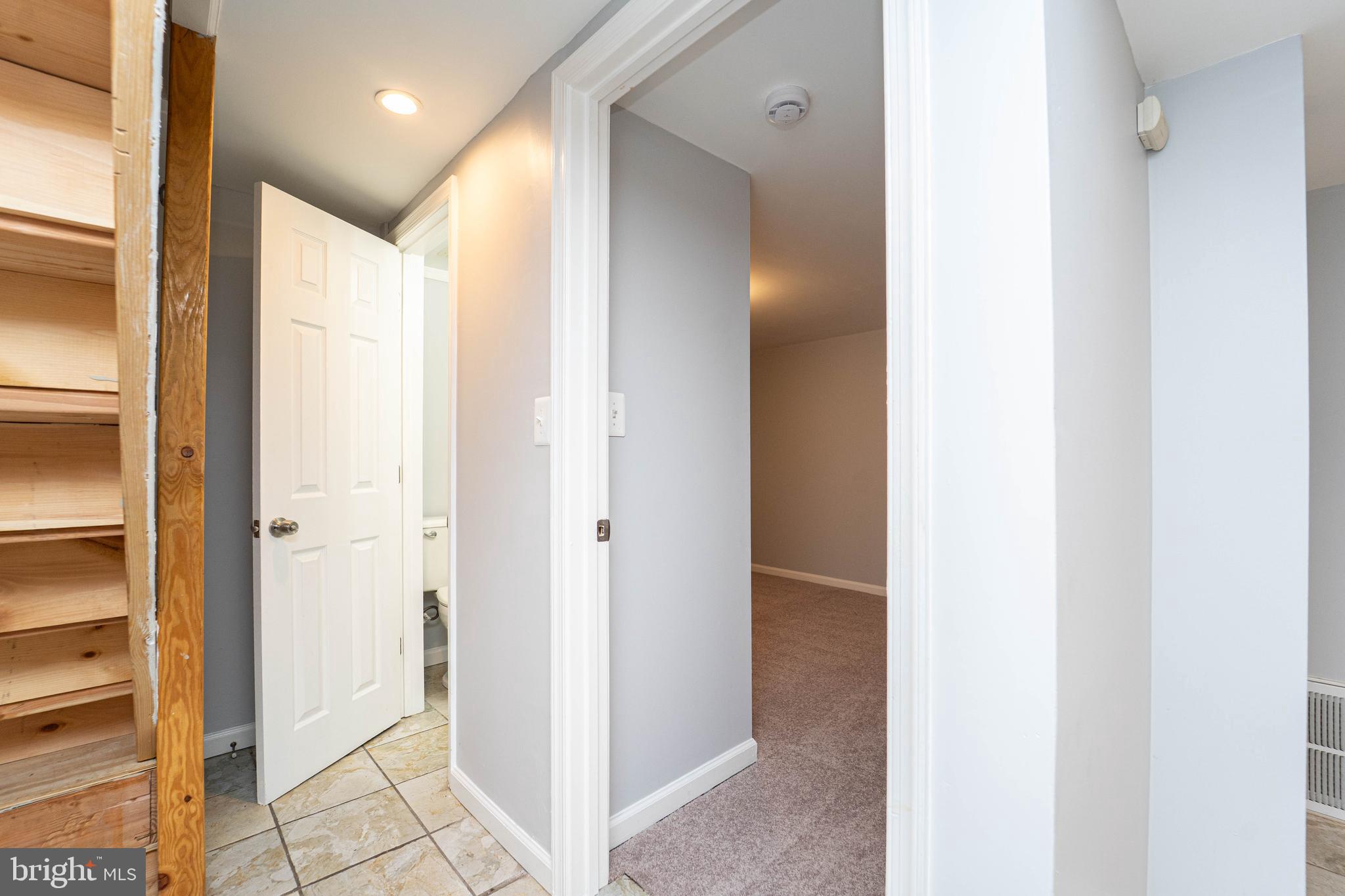 919 Kevin Road Baltimore, MD 21229 - Photo 17 of 38 a view of a hallway with wooden floor