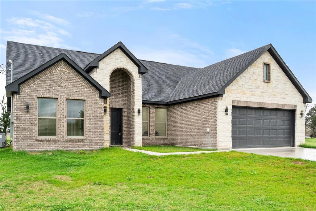 6771 Northwest County Road 1146 Barry, TX 75102 - Photo 27 of 34 front view of a house with a yard