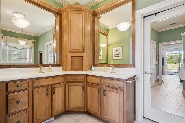 a spacious bathroom with a double vanity sink and a mirror