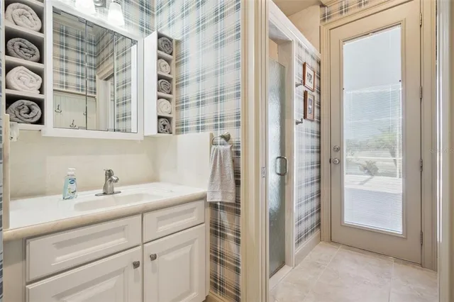 a bathroom with a sink and a mirror