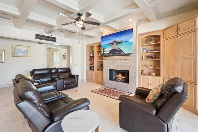 a living room with furniture fireplace and a flat screen tv