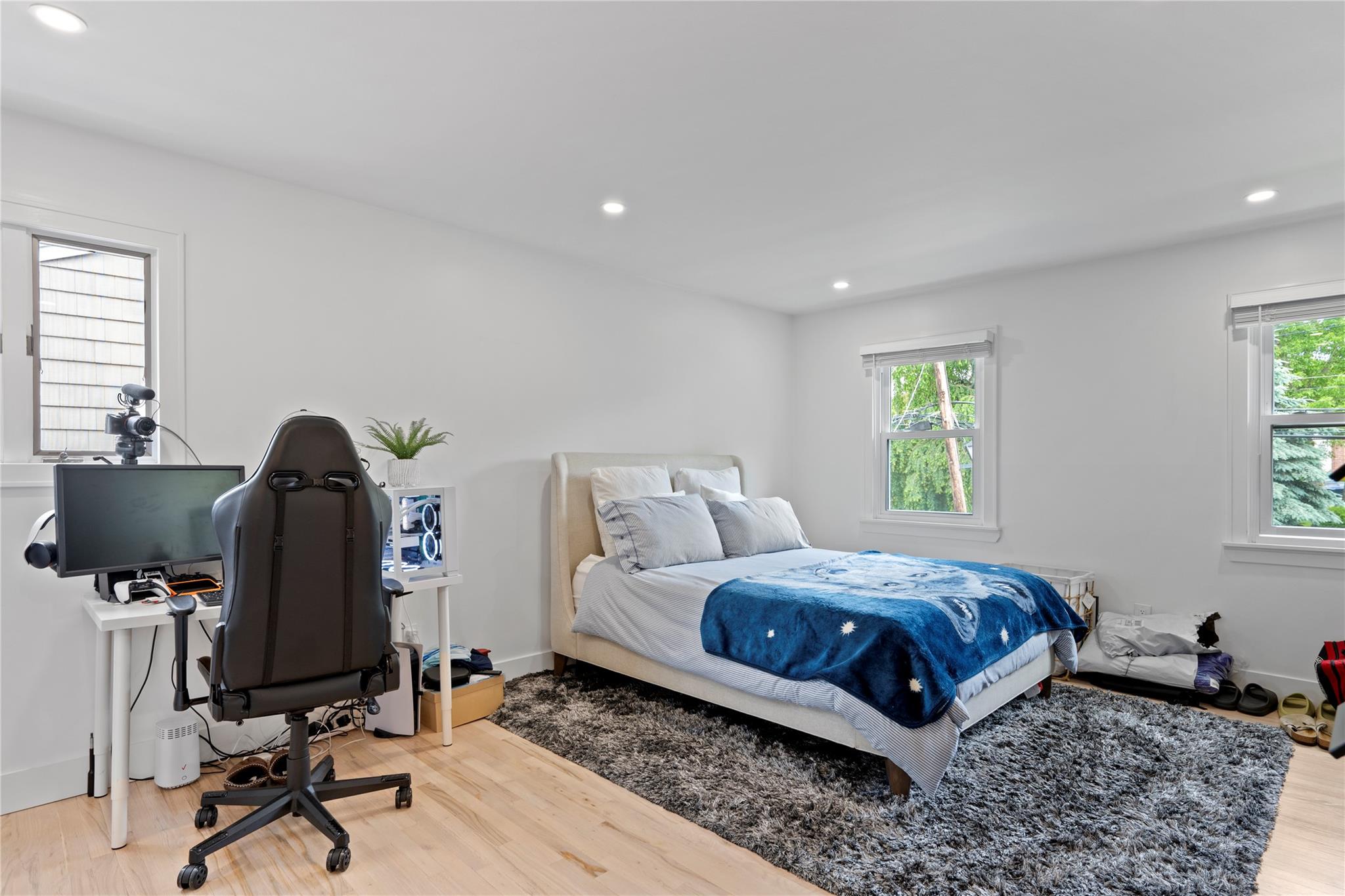 1 Bennett Avenue Huntington, NY 11746 - Photo 13 of 24 Bedroom featuring multiple windows, wood finished floors, and recessed lighting
