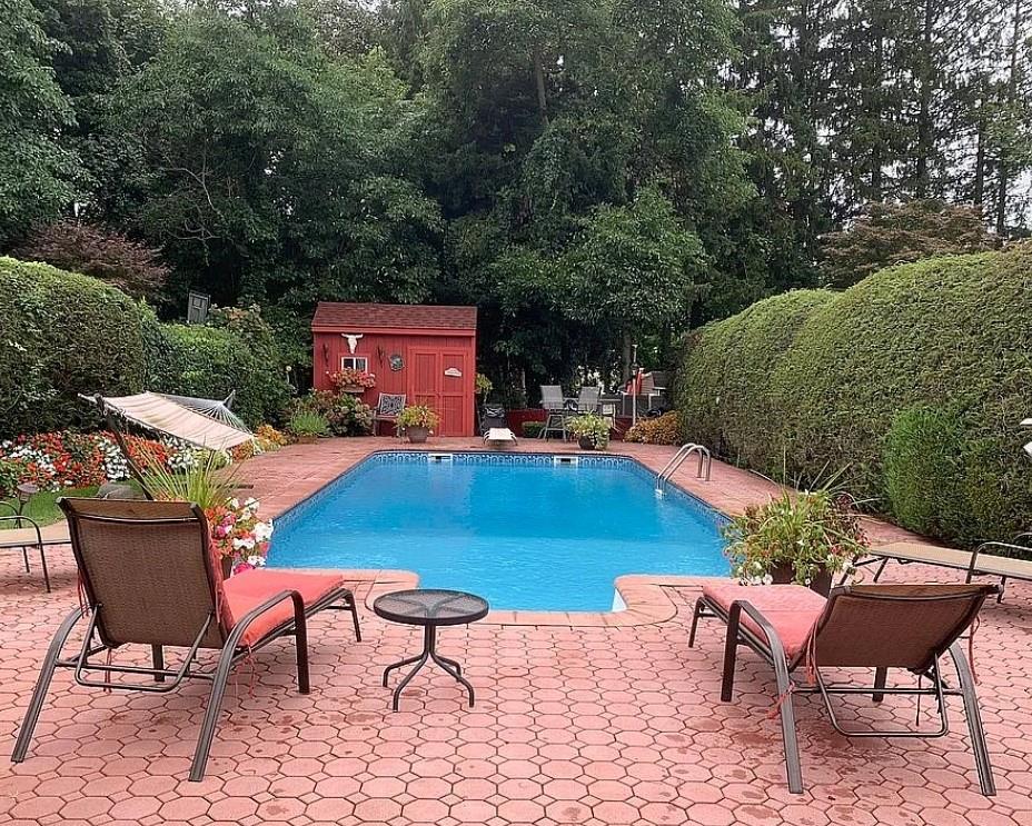 1 Bennett Avenue Huntington, NY 11746 - Photo 22 of 24 View of pool with a storage unit and a patio area