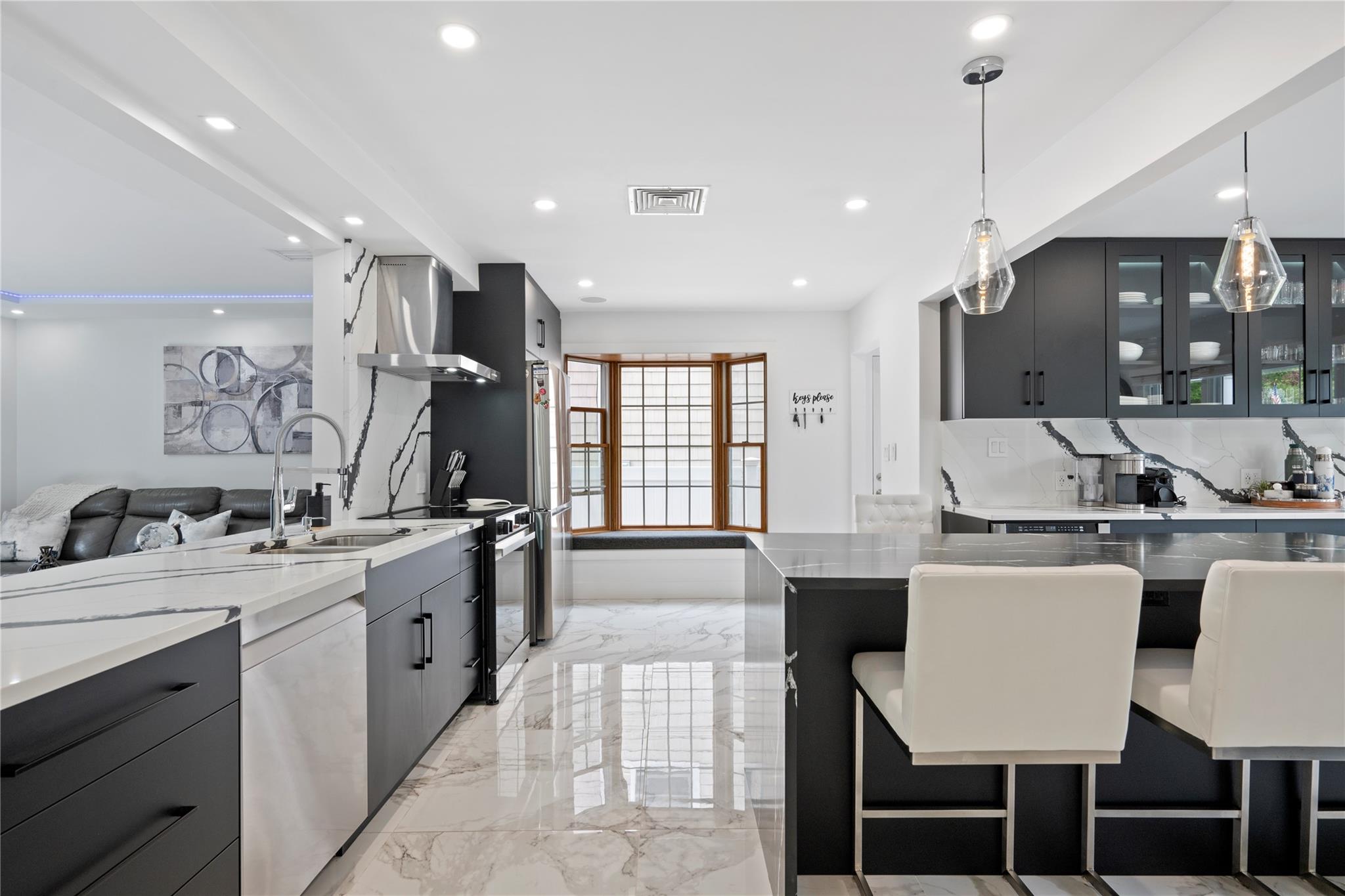 1 Bennett Avenue Huntington, NY 11746 - Photo 4 of 24 Kitchen with island range hood, dishwasher, electric range, light marble finish floors, and recessed lighting