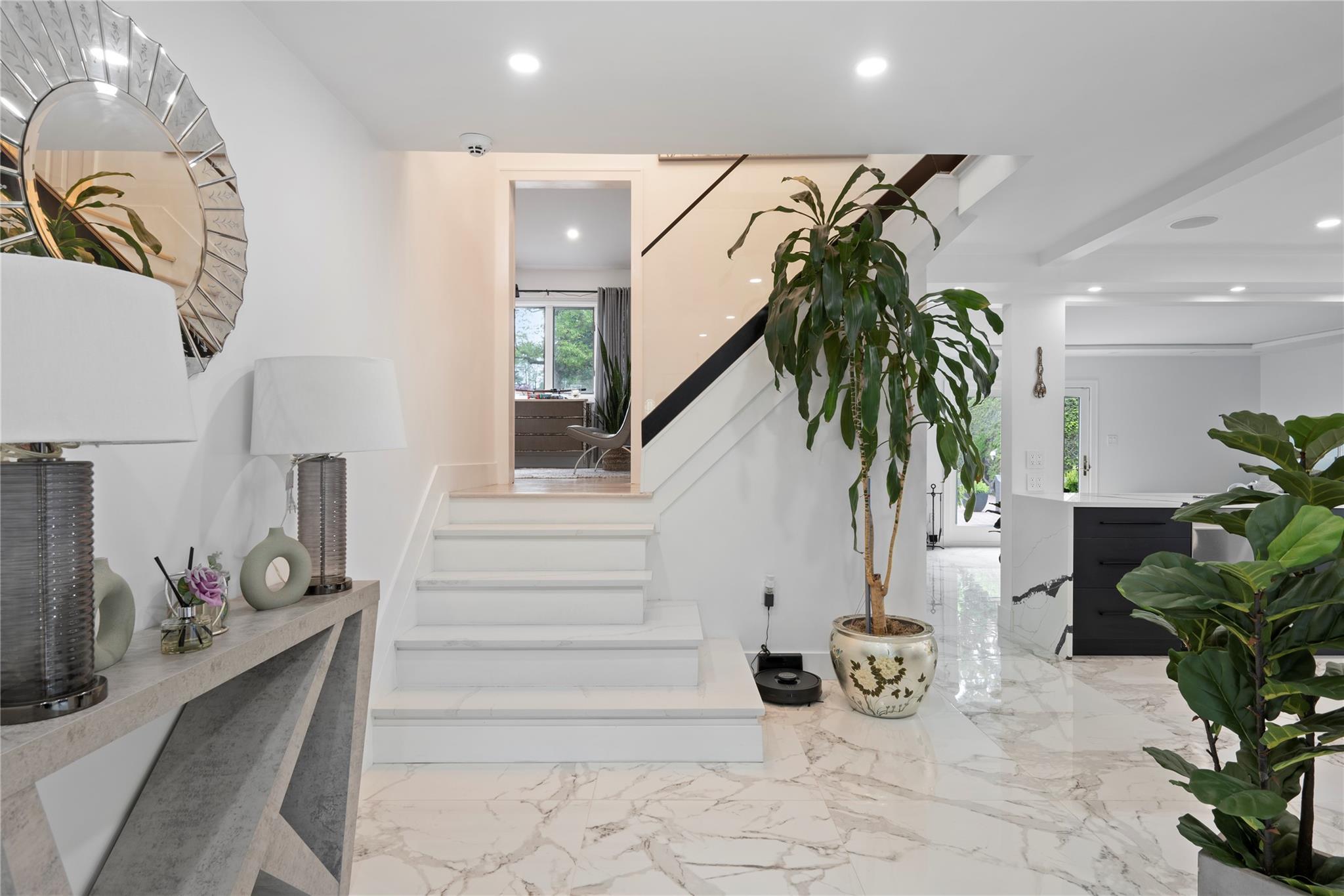 1 Bennett Avenue Huntington, NY 11746 - Photo 10 of 24 Staircase with marble finish floors and recessed lighting