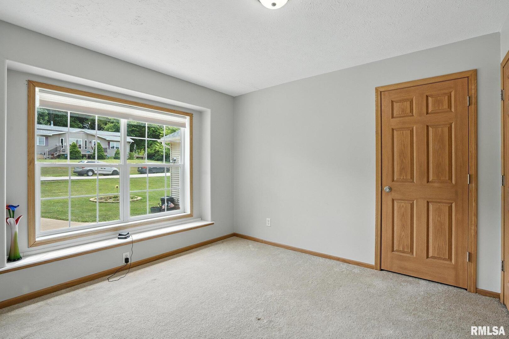 106 Valley View Drive Sherrard, IL 61281 - Photo 17 of 35 an empty room with windows