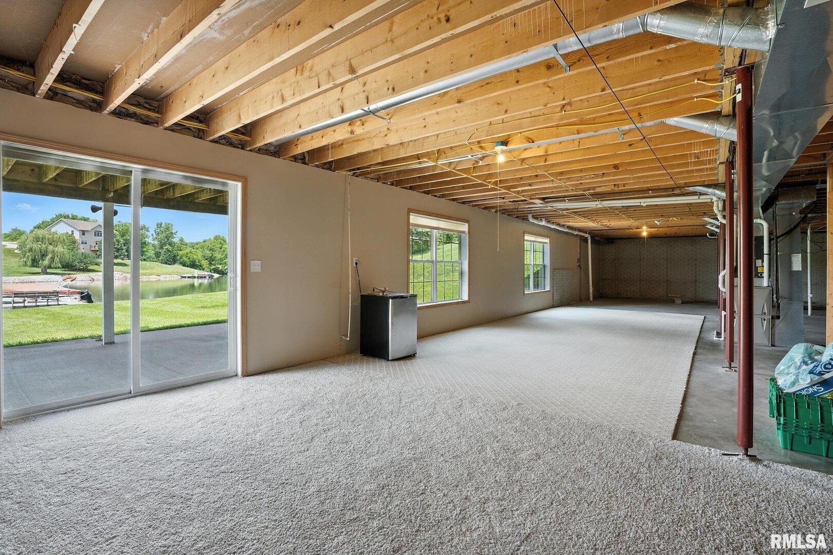 106 Valley View Drive Sherrard, IL 61281 - Photo 27 of 35 a view of an empty room with a balcony