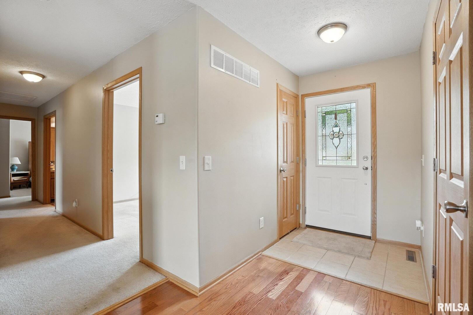 106 Valley View Drive Sherrard, IL 61281 - Photo 5 of 35 wooden floor with a bedroom and windows