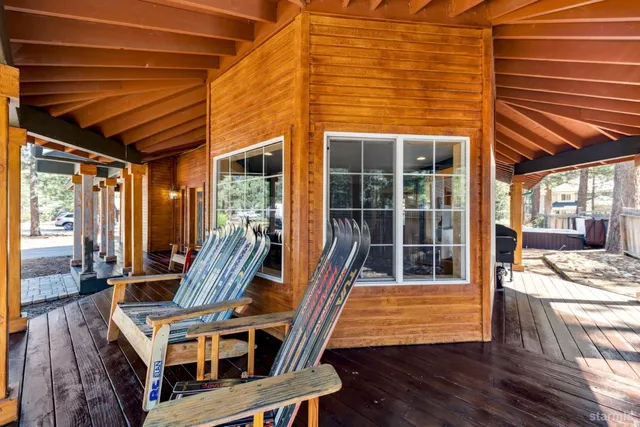 a view of a patio with table and chairs