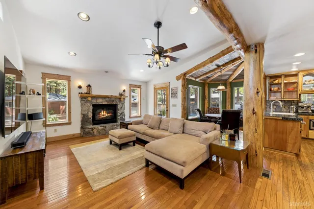 a living room with furniture fireplace and a flat screen tv