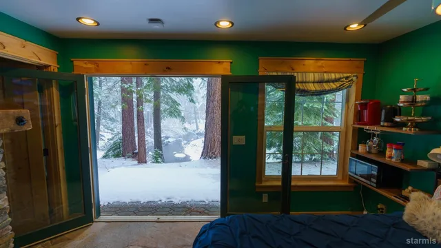a view of a living room with a large window