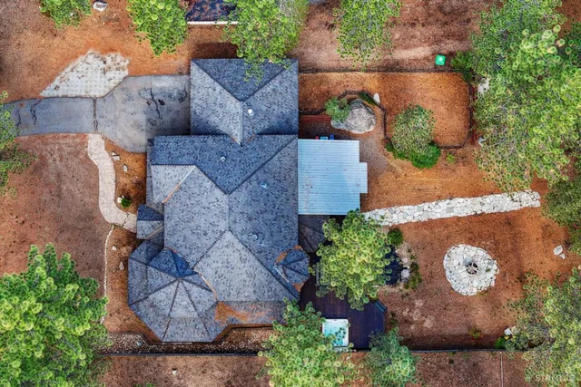 an aerial view of a house with outdoor space