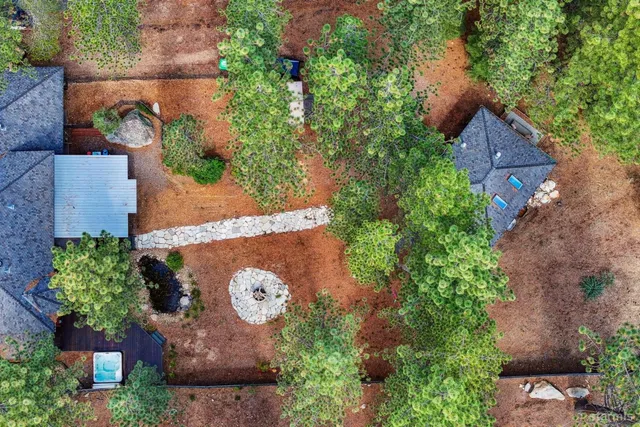 an aerial view of a house with yard