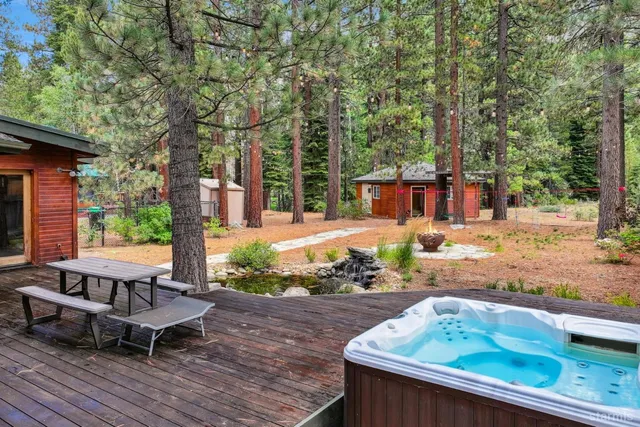 a view of a backyard with sitting area