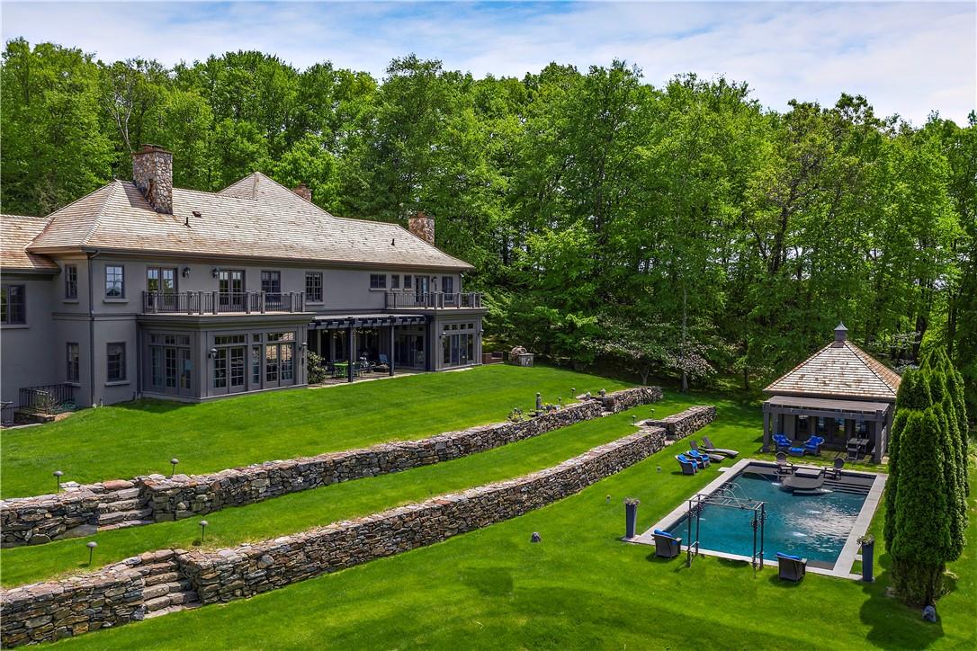 a aerial view of a house with a big yard