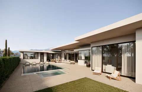 a house view with a seating space and a garden view