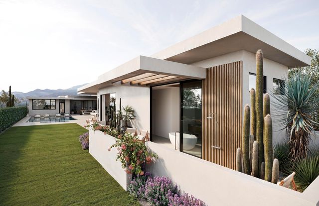 a front view of a house with yard patio and swimming pool