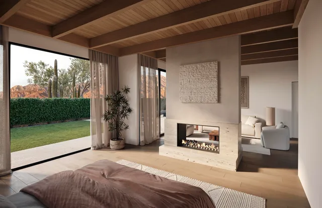 a bedroom with a bed and a fireplace