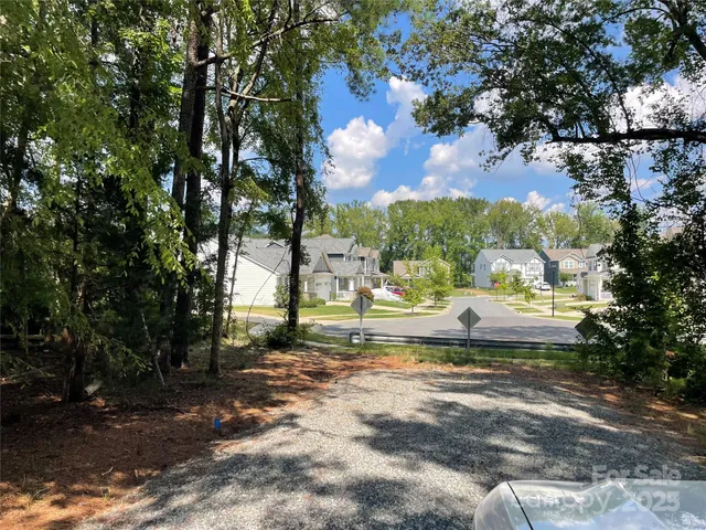 a view of a yard with swimming pool