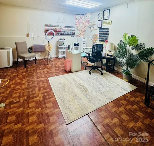 a workspace with furniture window and wooden floor