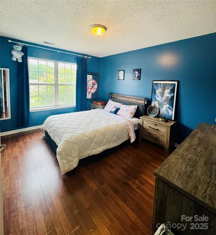 a bedroom with bed and window