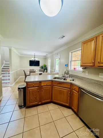 a kitchen with stainless steel appliances granite countertop a sink and cabinets