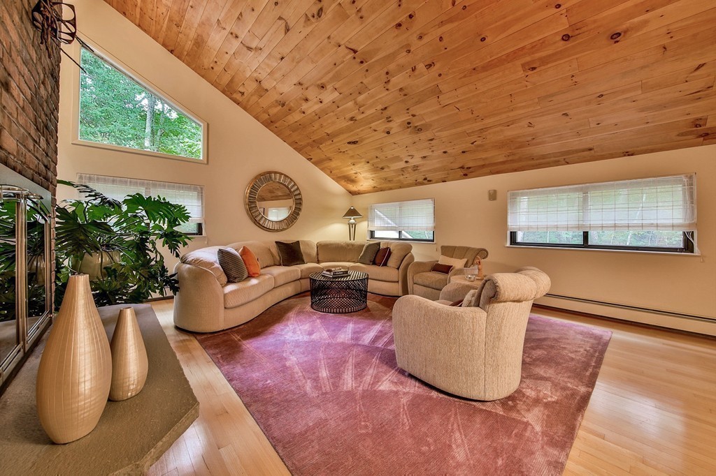 215 Littleton Road Harvard, MA 01451 - Photo 11 of 29 a living room with furniture and a large window