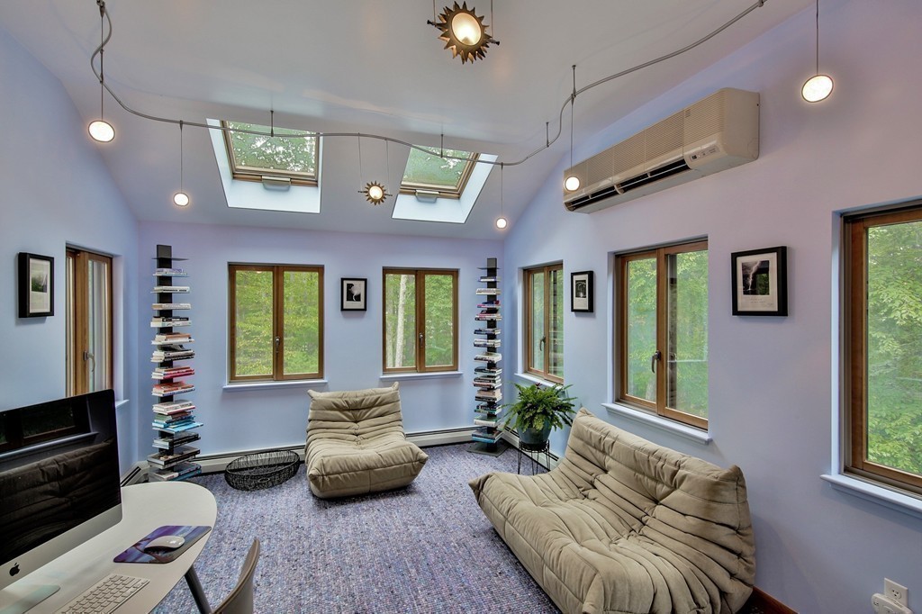 215 Littleton Road Harvard, MA 01451 - Photo 20 of 29 a living room with furniture and a fireplace