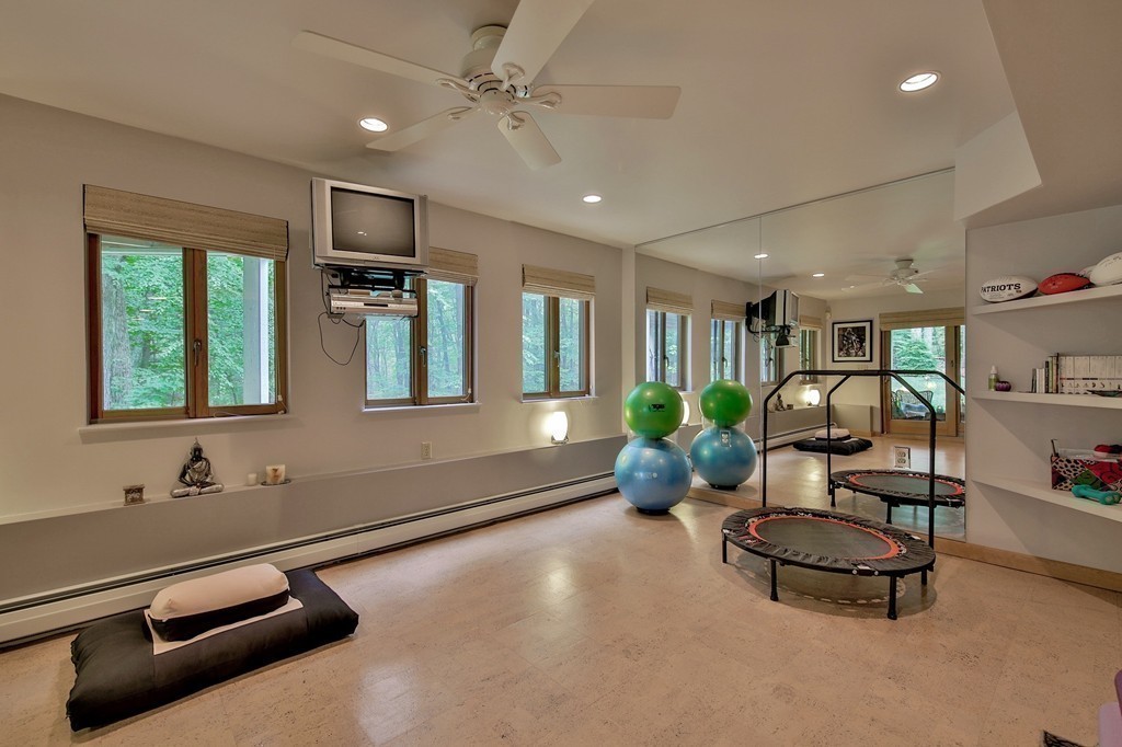 215 Littleton Road Harvard, MA 01451 - Photo 24 of 29 a living room with furniture gym equipment and a window