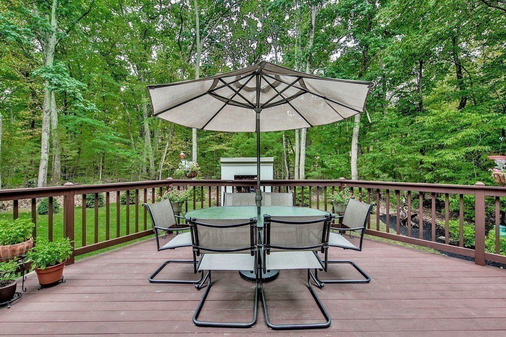 215 Littleton Road Harvard, MA 01451 - Photo 26 of 29 a view of a chair and table on the wooden deck