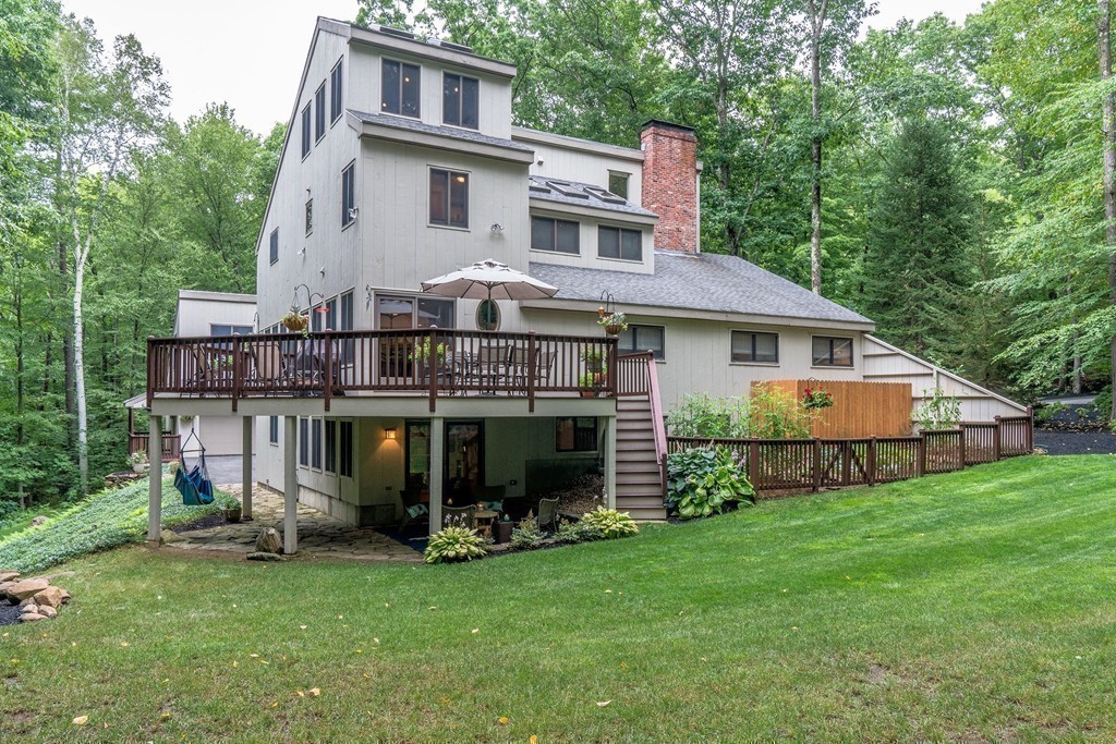215 Littleton Road Harvard, MA 01451 - Photo 29 of 29 a view of a house with a yard and sitting area