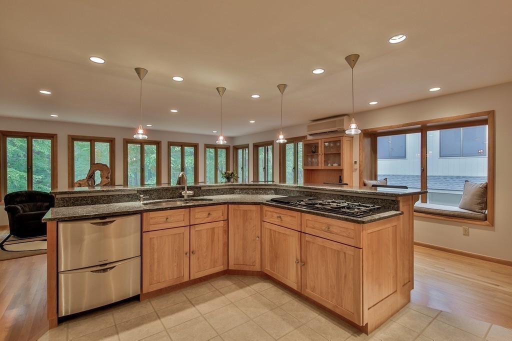 215 Littleton Road Harvard, MA 01451 - Photo 5 of 29 a large kitchen with stainless steel appliances granite countertop a stove and a sink