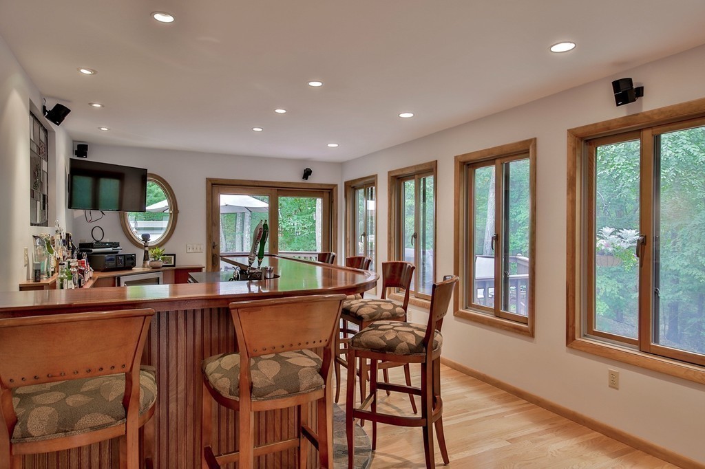 215 Littleton Road Harvard, MA 01451 - Photo 7 of 29 a dining room with furniture a chandelier and wooden floor