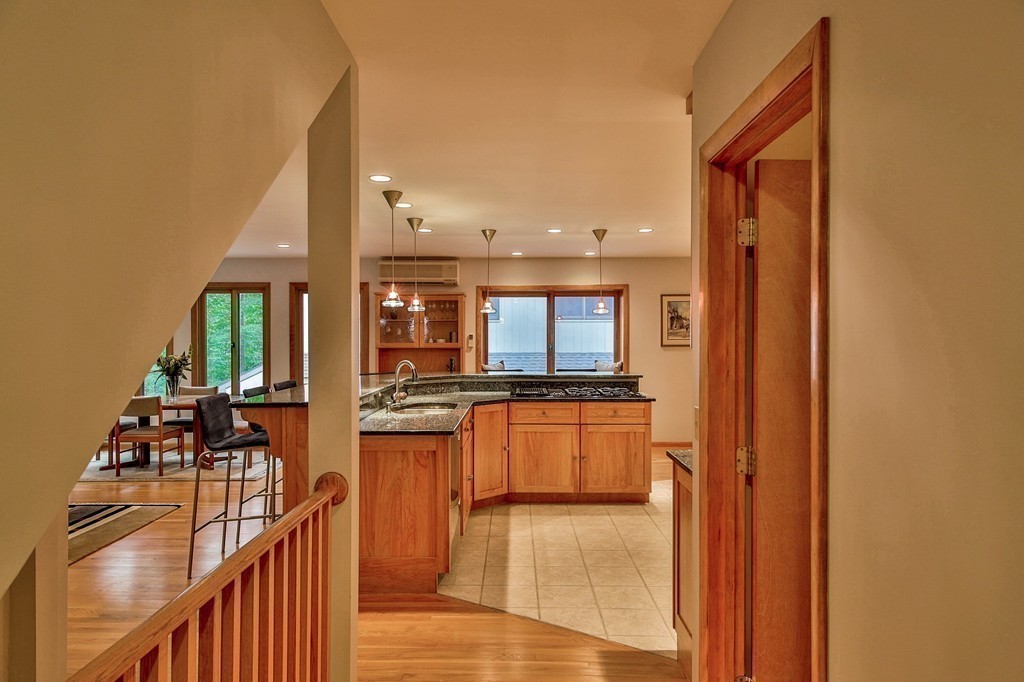 215 Littleton Road Harvard, MA 01451 - Photo 8 of 29 a kitchen with stainless steel appliances granite countertop a refrigerator and a stove top oven