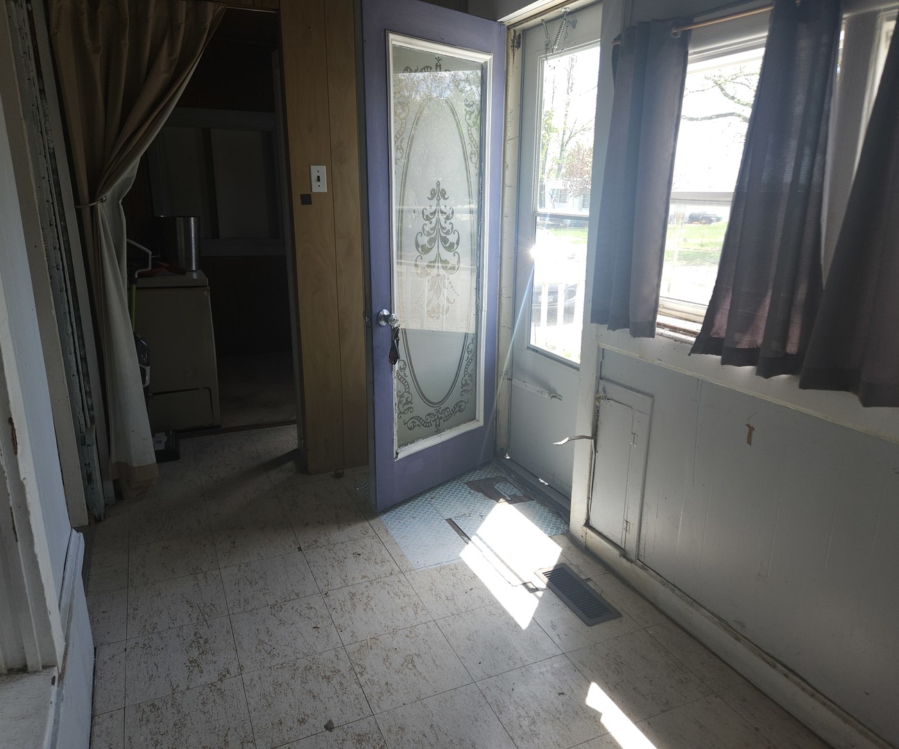 303 South Spruce Street Villa Grove, IL 61956 - Photo 2 of 10 a view of an empty room with a fireplace