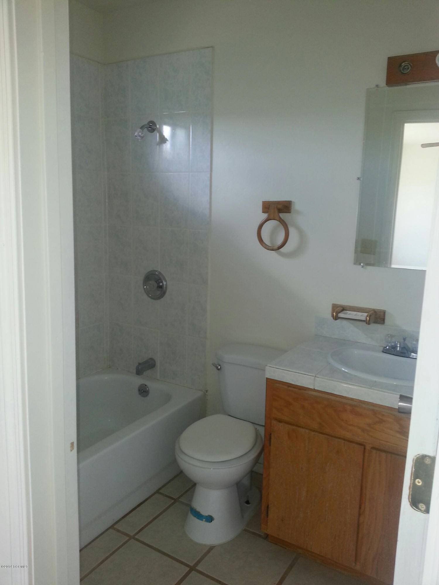 315 Camino Arenosa Rio Rico, AZ 85648 - Photo 10 of 11 a bathroom with a granite countertop toilet a sink and a bathtub