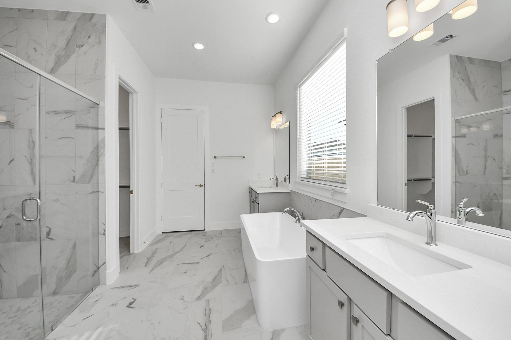 9507 Chateau Hill Manvel, TX 77578 - Photo 12 of 32 a bathroom with a sink double vanity and shower