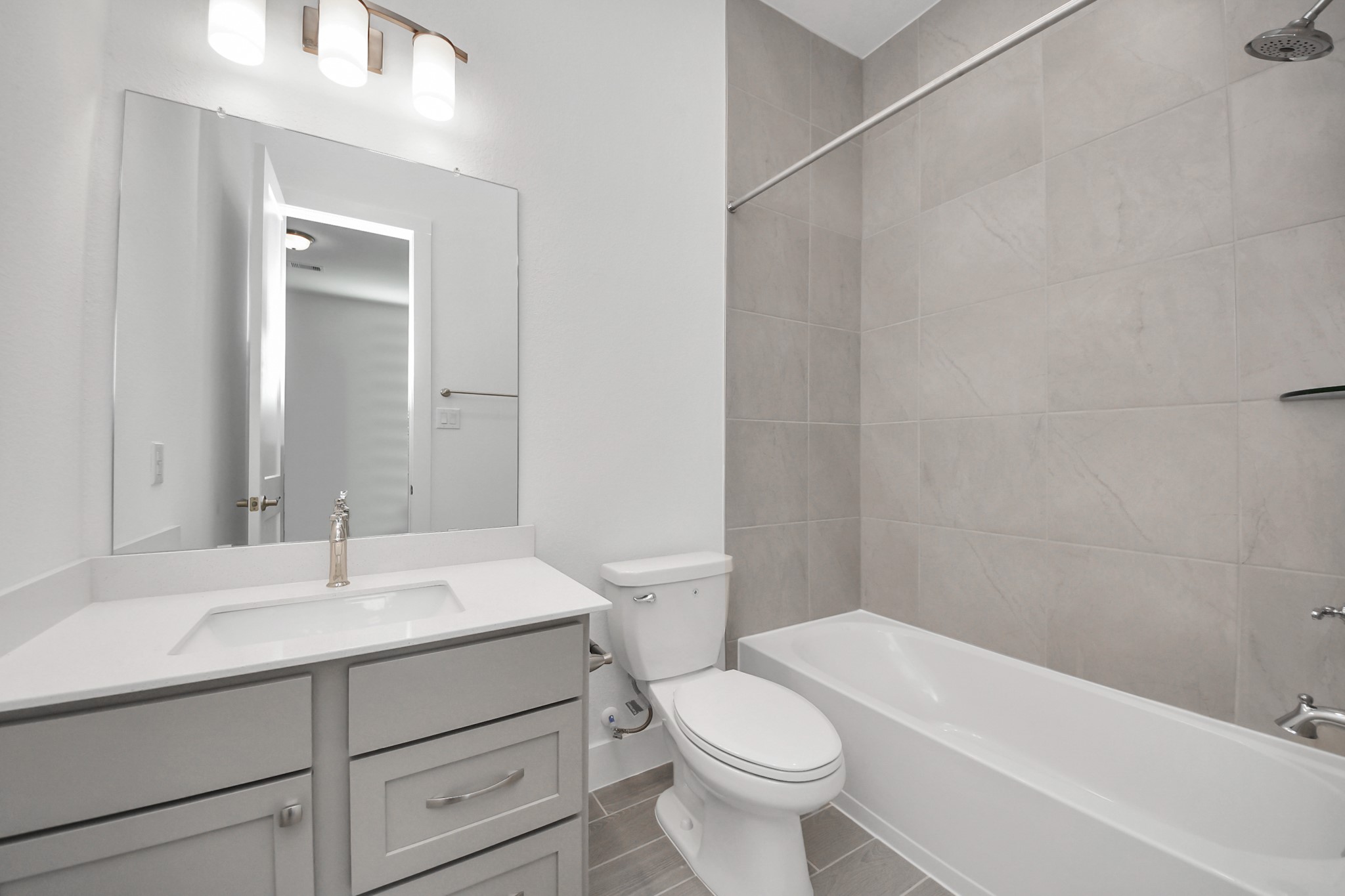 9507 Chateau Hill Manvel, TX 77578 - Photo 19 of 32 a bathroom with a sink a toilet and shower