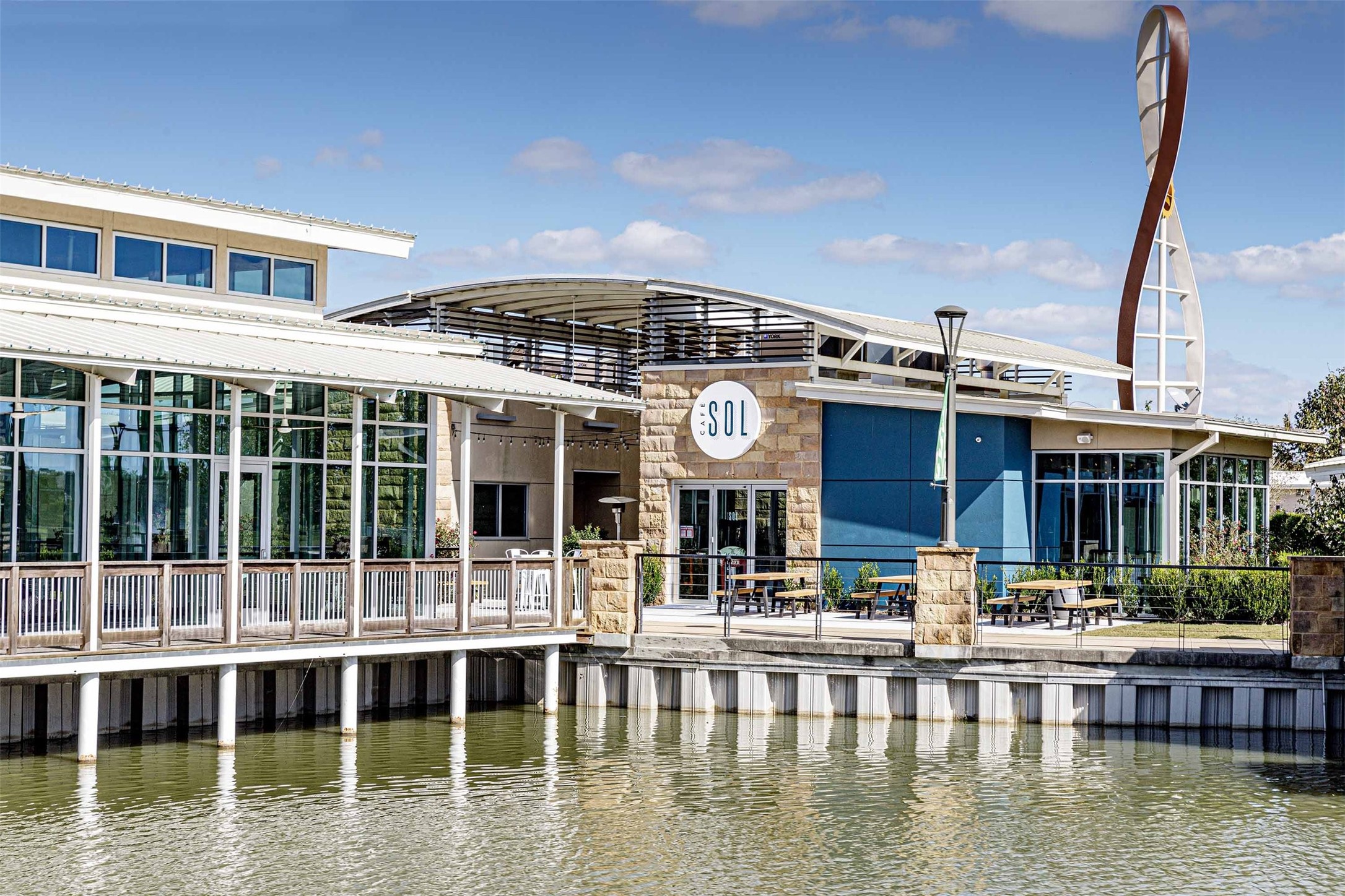 9507 Chateau Hill Manvel, TX 77578 - Photo 27 of 32 a view of a large building with a lake view