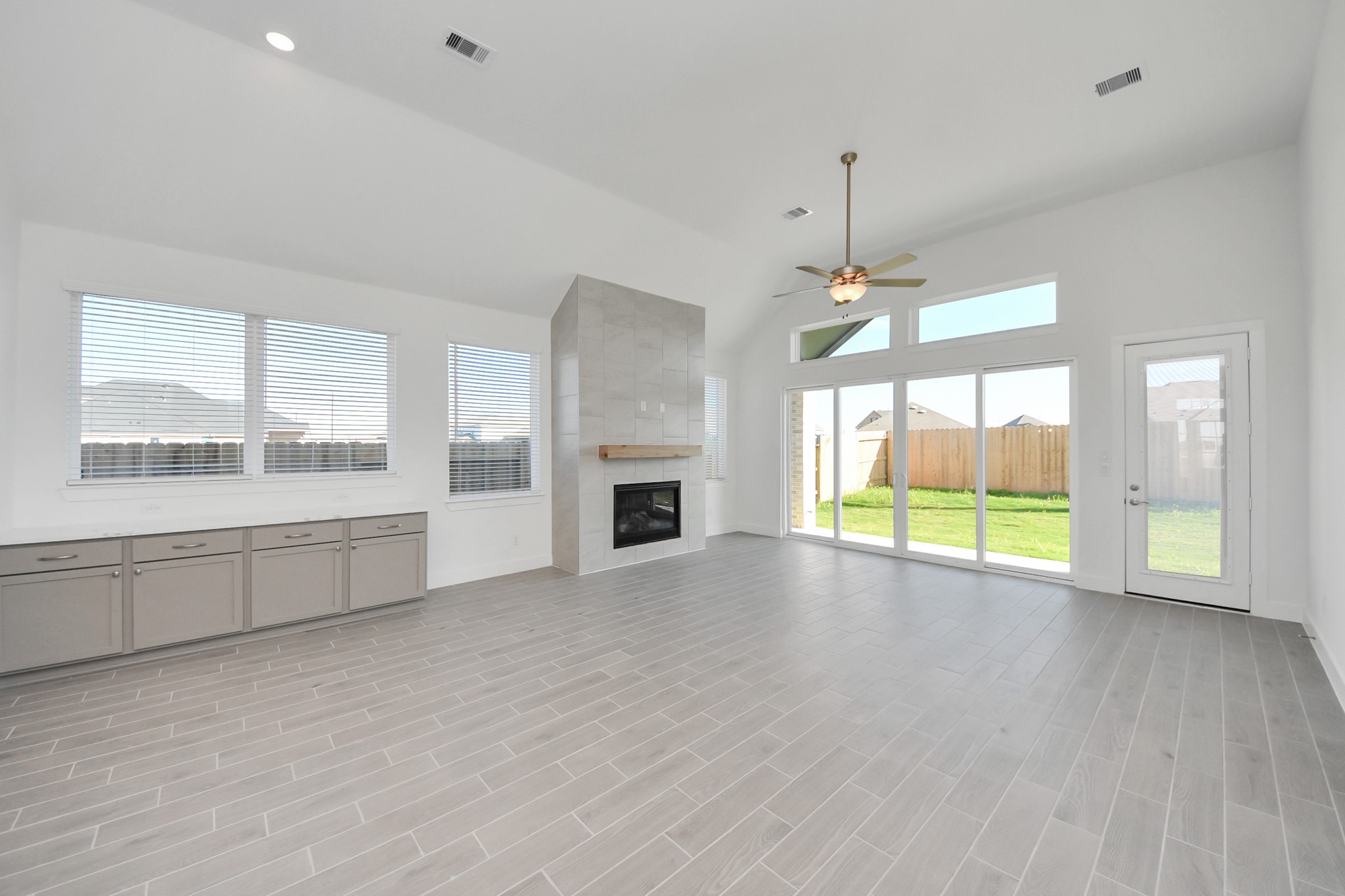 9507 Chateau Hill Manvel, TX 77578 - Photo 9 of 32 an empty room with windows and fireplace