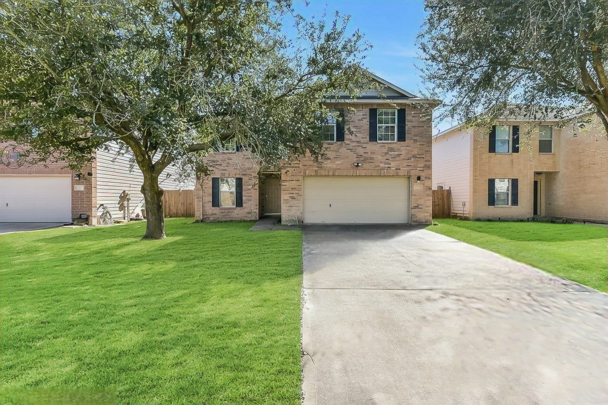 20011 Spring Wreath Lane Cypress, TX 77433 - Photo 2 of 39 a view of house with a garden