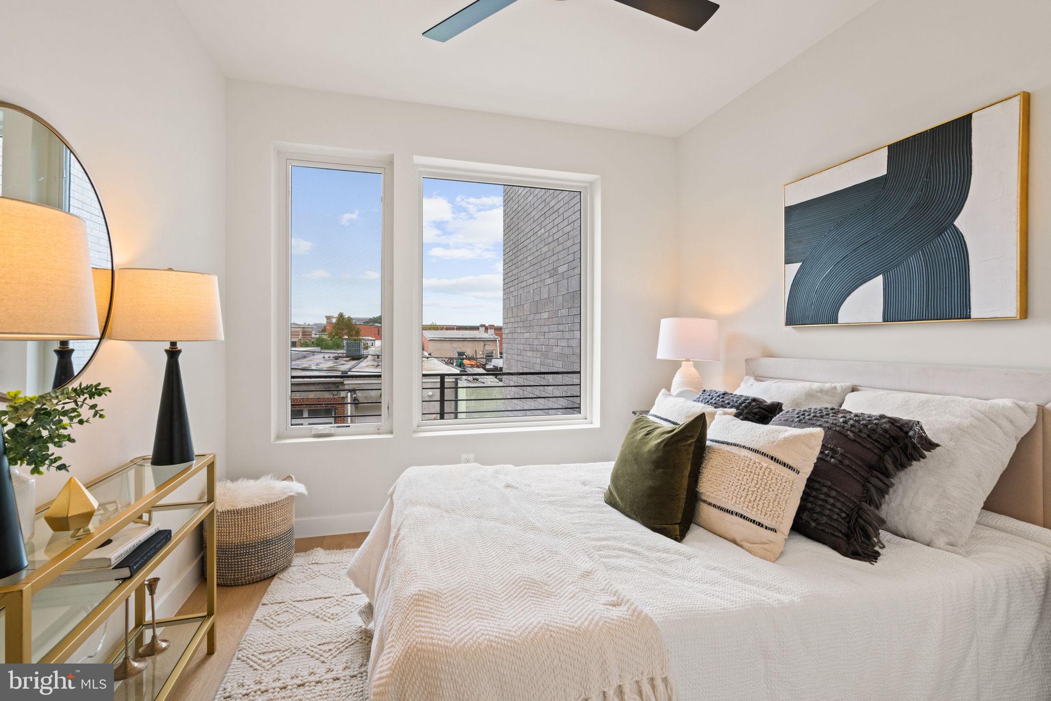 733 8th Street Southeast, Unit 2 Washington, DC 20003 - Photo 10 of 17 a bedroom with a bed and a large window