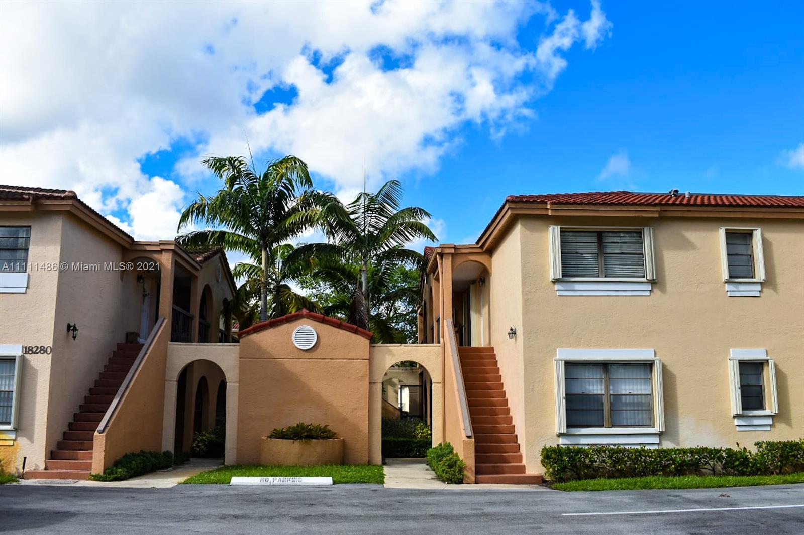 18280 Mediterranean Boulevard, Unit 43 Hialeah, FL 33015 - Photo 1 of 28 a house view with a garden space