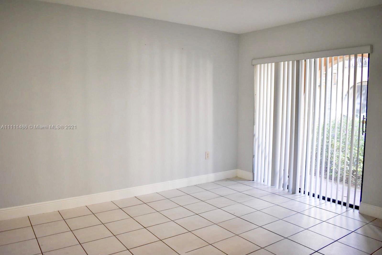 18280 Mediterranean Boulevard, Unit 43 Hialeah, FL 33015 - Photo 11 of 28 a view of an empty room and window
