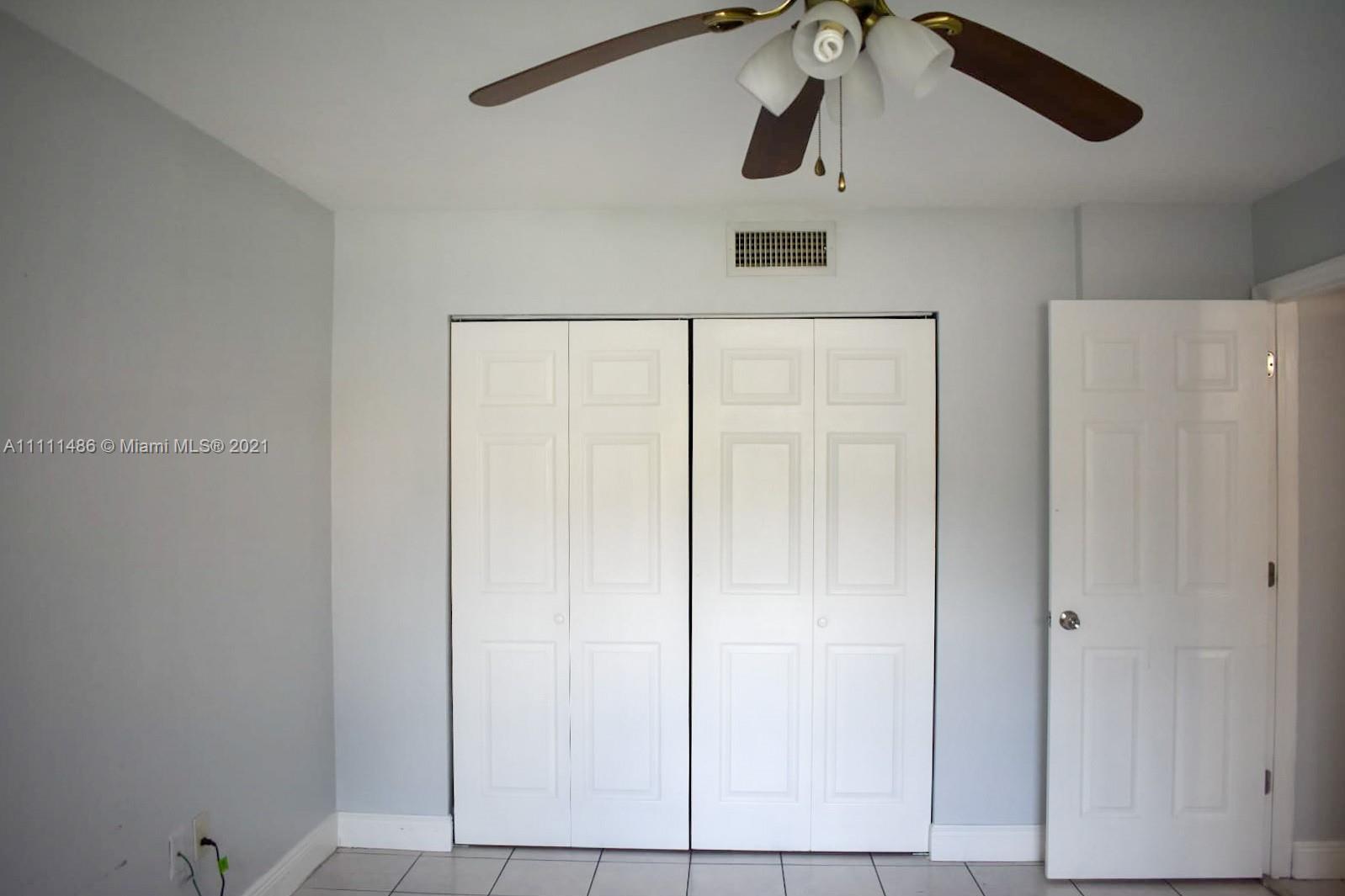 18280 Mediterranean Boulevard, Unit 43 Hialeah, FL 33015 - Photo 14 of 28 a view of a refrigerator and window in a room